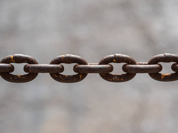 istock Taut Rusty Old Chain Close-up, Left to Right 1369182426