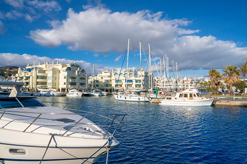 Benalmadena marina port harbor with boats and cityscape Costa del sol of Malaga in Andalusia Spain