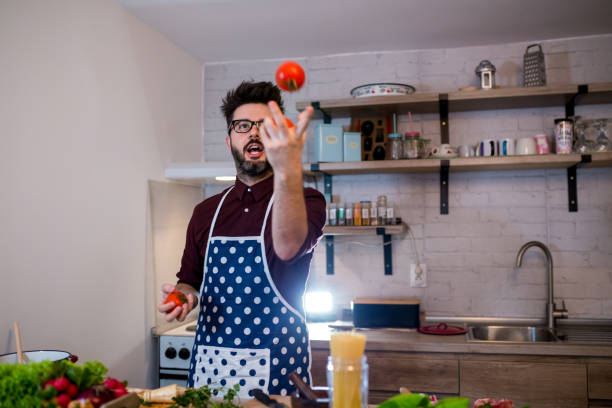 istock Portrait of handsome man in kitchen 1369184762