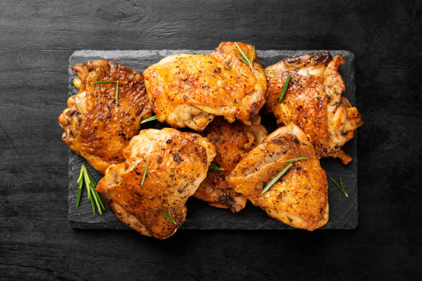 Grilled chicken thighs Grilled chicken thighs with spices and lemon. chicken meat stock pictures, royalty-free photos & images