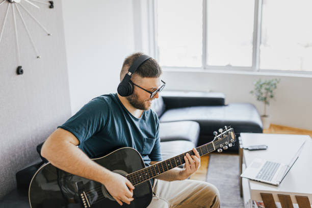 Acoustic guitar teaching through a video callteaching,