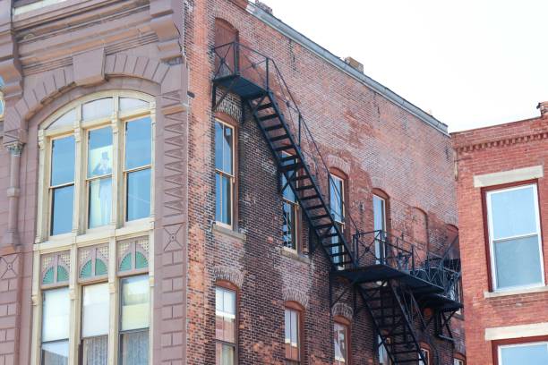 Fire escape on the side of an old small town building from 1875.