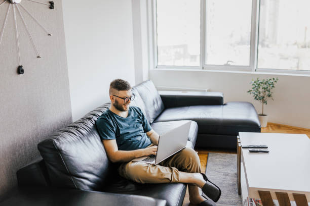 istock Man working at home and having Zoom Meeting on laptop 1369186218