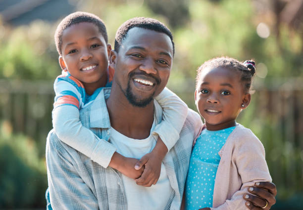 istock Shot of a man spending time outdoors with his two children 1369187543