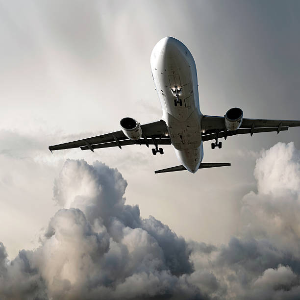 istock XL jet airplane landing in storm 136918820