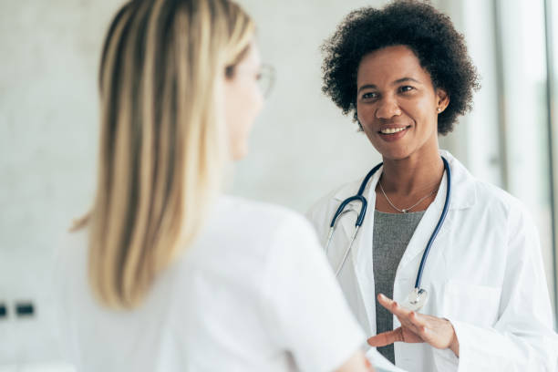 istock Two doctors talking at hospital 1369188206
