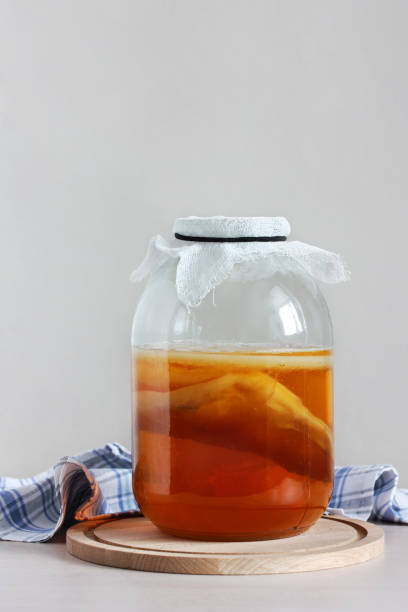 istock kombucha in a jar on the table. 1369188360