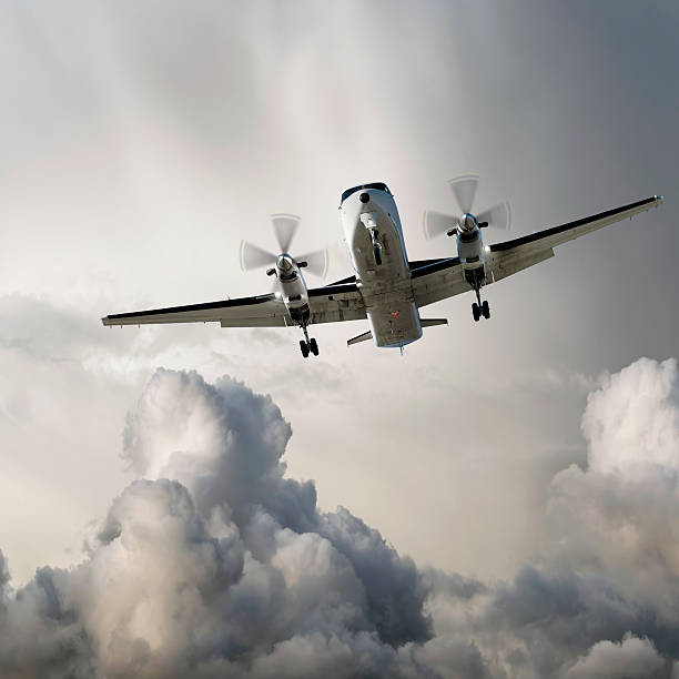 istock XL propeller airplane landing in storm 136918838