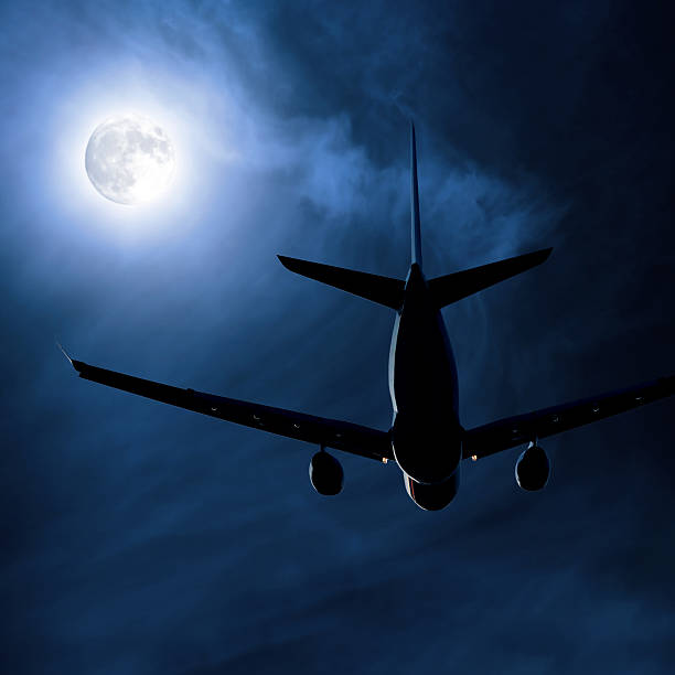 istock jet airplane taking off at night 136918853