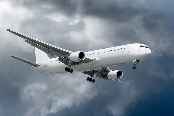 istock 3XL jet airplane landing in storm 136918904