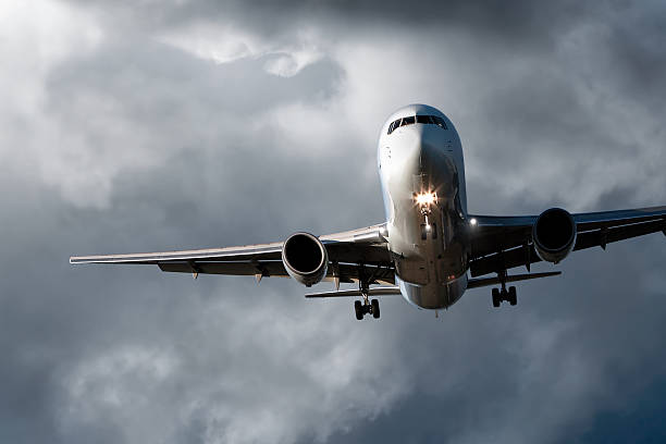 istock jet airplane landing in storm 136918971