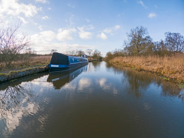 istock Narrowboat moored on a British canal in rural setting 1369190003