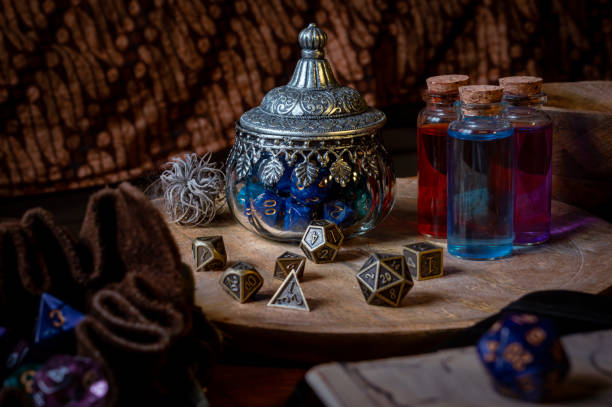 Glass ornate pot filled with blue RPG dice stock photo