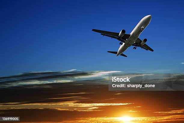 Jet Airplane Taking Off At Sunset Stock Photo - Download Image Now - Air Vehicle, Airplane, Sky
