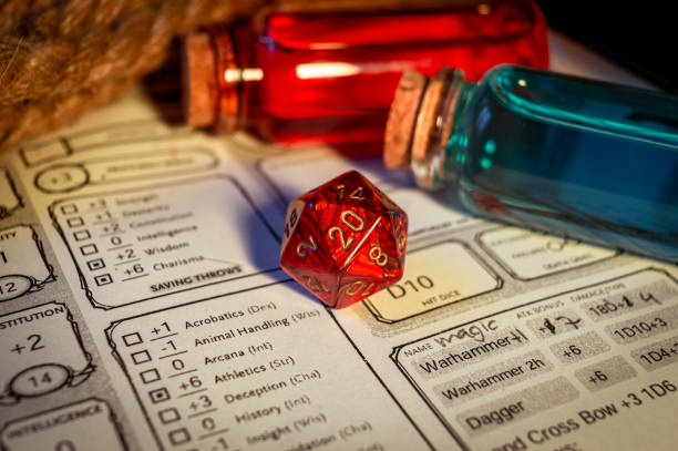 Close-up of a red d20  on a character sheet stock photo