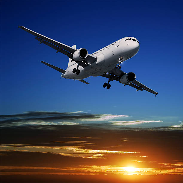 istock XL jet airplane landing at sunset 136919011
