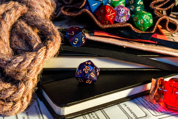 istock Close-up of a purple d20 on a black note-book 1369190129