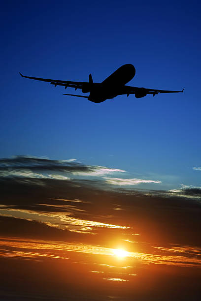 istock XXL jet airplane taking off at sunset 136919047