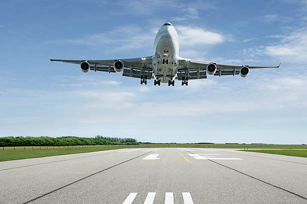 jumbo jet airplane landing stock photo