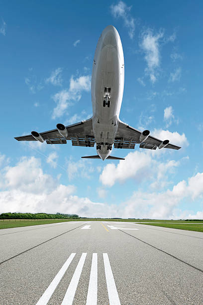 istock XL jet airplane landing on runway 136919246