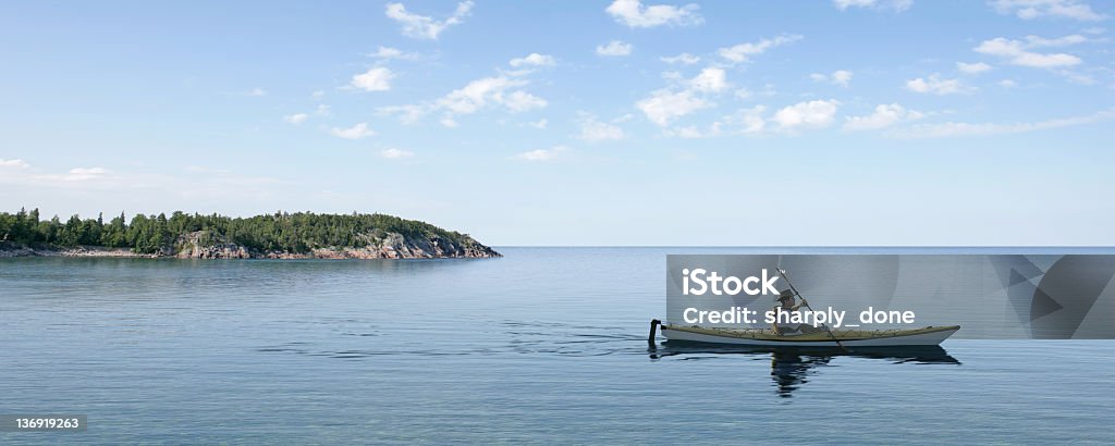 XL summer kayaking man kayaking on bright summer day, panoramic frame (XL) Lake Stock Photo