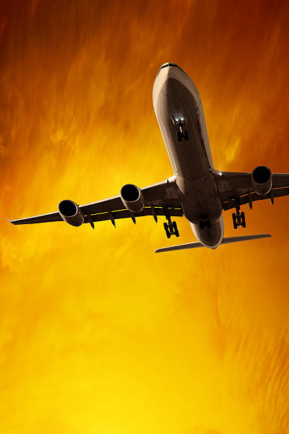 istock jet airplane landing at sunset 136919352