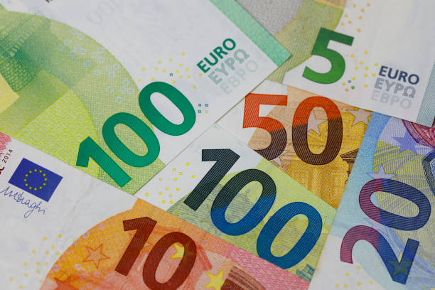 Euro currency notes lie next to each other, EUR money stock photo