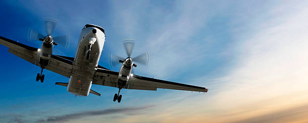 istock propeller airplane landing at sunset 136919740