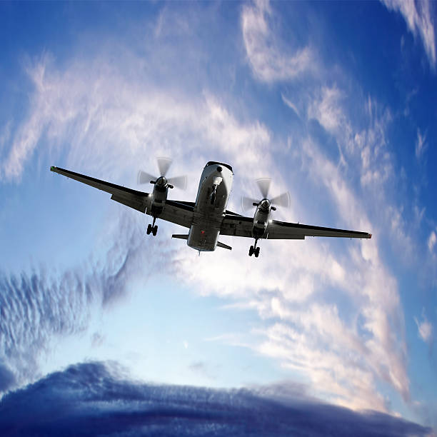 istock XXL propeller airplane landing at twilight 136919747