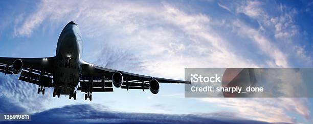 Jumbo Jet Airplane Landing At Twilight Stock Photo - Download Image Now - Leaving, Above, Aerospace Industry