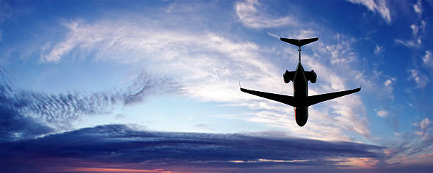 XL corporate jet airplane flying at twilight