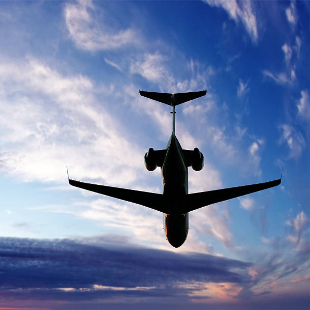 istock corporate jet airplane flying at twilight 136919824