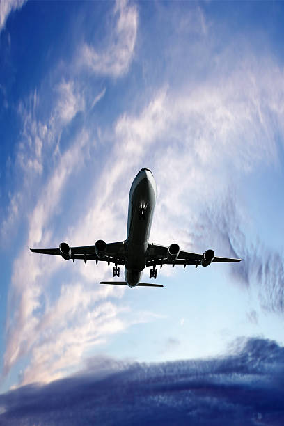 istock XXL jet airplane landing at twilight 136919831