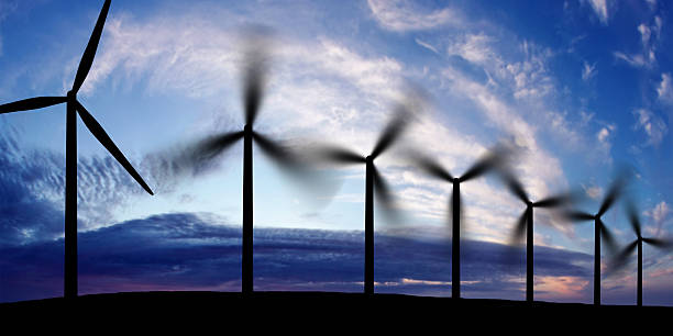 wind farm silhouette wind farm in silhouette at sunset, panoramic frame landscape alternative energy scenics farm stock pictures, royalty-free photos & images