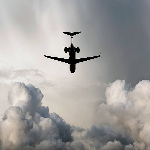 istock XXL corporate jet airplane flying in storm 136919974