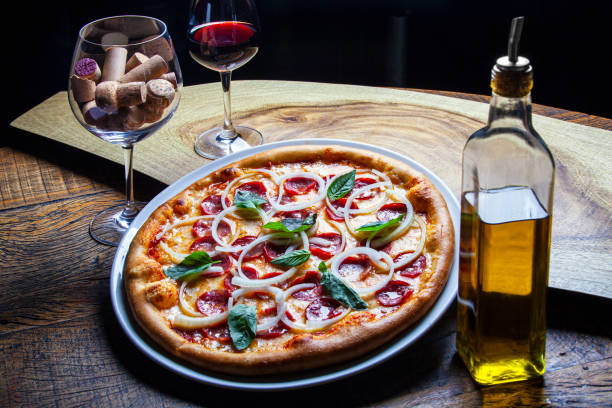 istock Pepperoni pizza with onion rings 1369201199