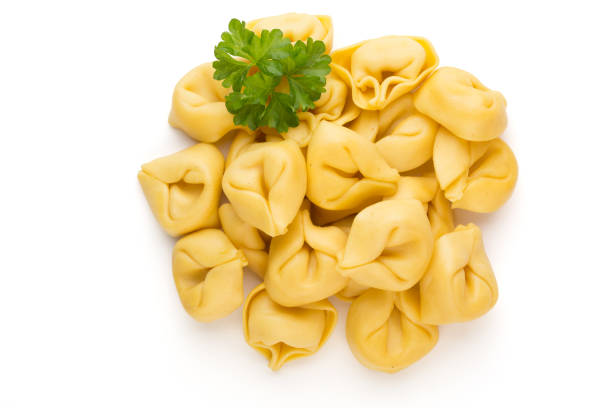 istock Raw homemade pasta,tortellini with herbs. 1369202147