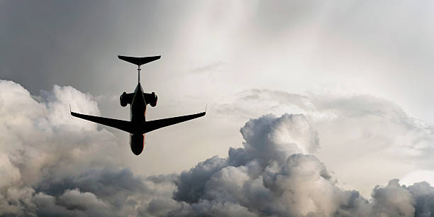 istock XL corporate jet airplane flying in storm 136920269