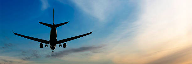 istock XL jet airplane landing at sunset 136920294