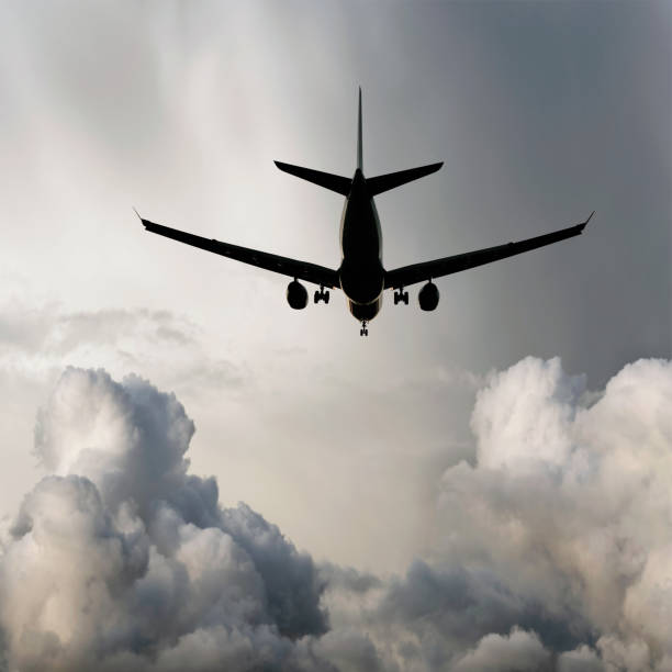 istock XL jet airplane landing in storm 136920335