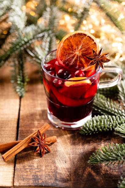 istock Christmas mulled wine with spices on a wooden rustic table. 1369203539