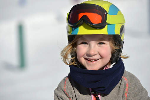 Closeup of a young girl skiing and having fun in the ski resort of St .Anton am Arlberg, Austria.