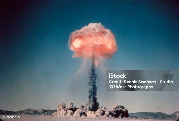 Old Slide Scan Of Atom Bomb Exploding In The Desert With Red Hot Fire Cloud At The Top Stock Photo - Download Image Now