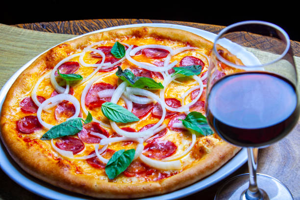 istock Pepperoni pizza with onion rings 1369204899