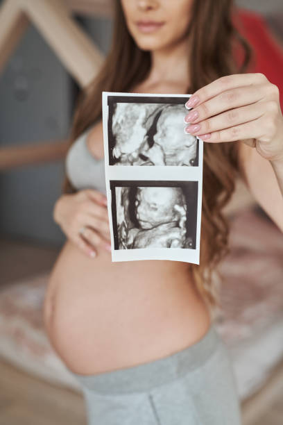 istock Pregnant woman at home 1369204997