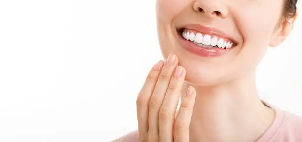 Photo of Perfect healthy teeth smile of a young woman. Teeth whitening. Dental clinic patient. Image symbolizes oral care dentistry, stomatology. Dentistry image