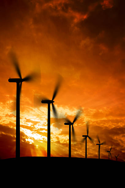 XXXL wind farm silhouette wind farm in silhouette at dusk, vertical frame (XXXL) landscape alternative energy scenics farm stock pictures, royalty-free photos & images