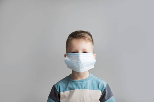 istock Child wearing the mask for protect them self from coronavirus and flu outbreak. Quarantine. 1369208552