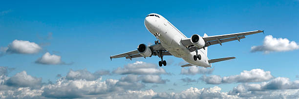 istock XL jet airplane landing in bright sky 136920888