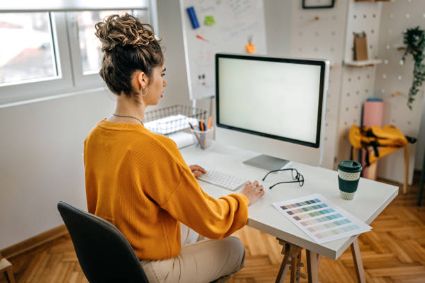 istock Businesswoman working on computer in office 1369209270